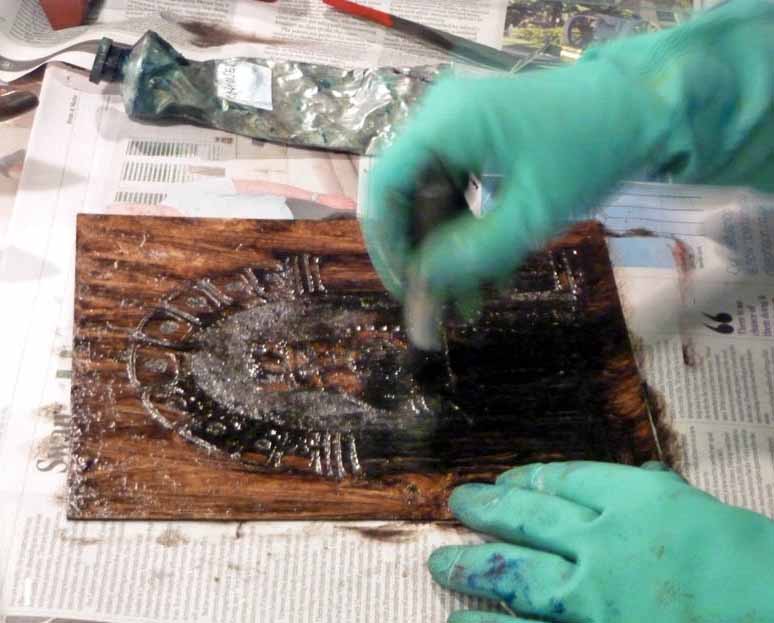 2. Pushing the ink into the levels of the plate